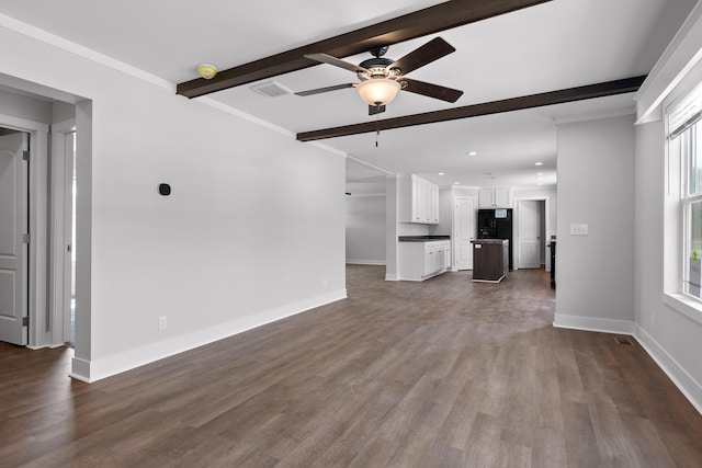 unfurnished living room featuring ceiling fan, hardwood / wood-style floors, and beam ceiling