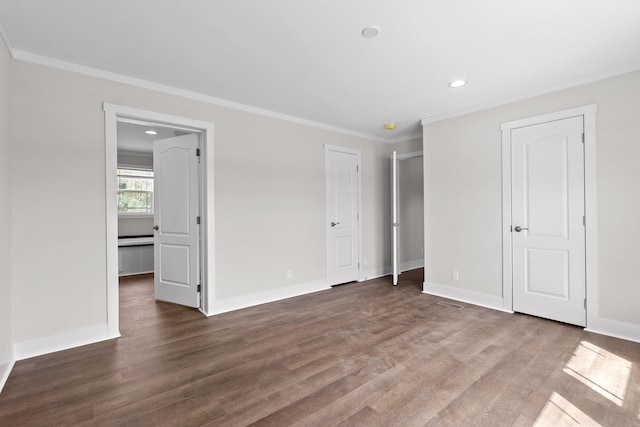 unfurnished bedroom featuring ornamental molding and hardwood / wood-style floors