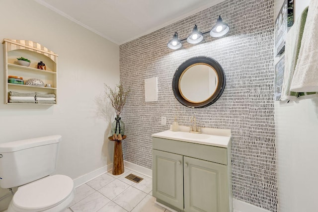 bathroom featuring crown molding, vanity, toilet, and tile walls