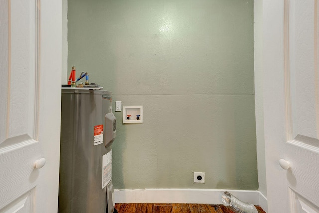 utility room featuring electric water heater