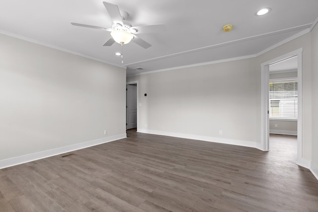 empty room with crown molding, ceiling fan, and dark wood-type flooring