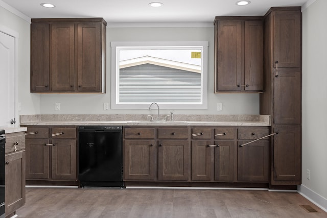 kitchen featuring dark brown cabinetry, dishwasher, light wood-type flooring, and sink