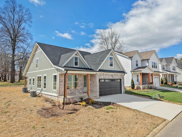 modern farmhouse style home featuring brick siding, board and batten siding, concrete driveway, and a shingled roof