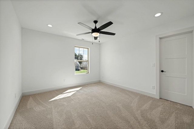 unfurnished room featuring carpet, visible vents, baseboards, recessed lighting, and ceiling fan