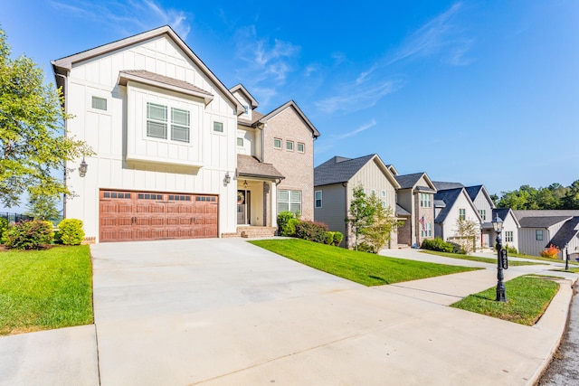 view of front of home featuring a garage and a front lawn