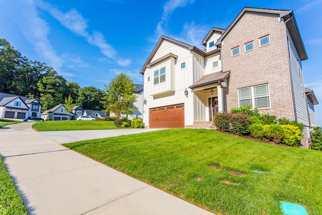 view of front facade with a garage and a front yard