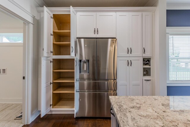 kitchen featuring stainless steel fridge with ice dispenser, plenty of natural light, and dark hardwood / wood-style floors