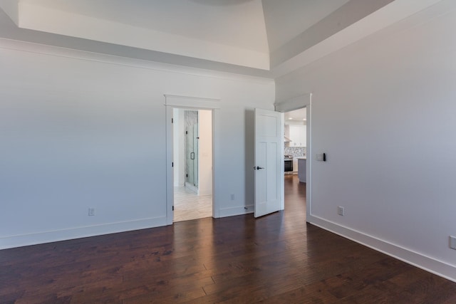 unfurnished bedroom with dark wood-type flooring