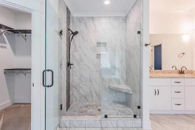 bathroom with an enclosed shower, crown molding, and vanity