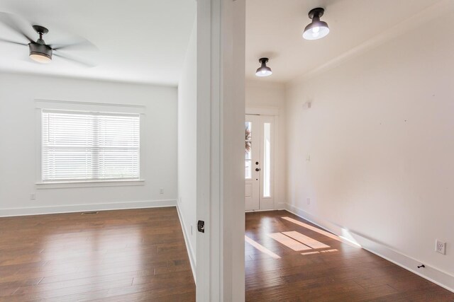 foyer entrance featuring ceiling fan and dark hardwood / wood-style flooring