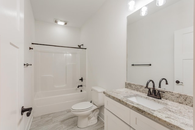 full bathroom with vanity, toilet, and washtub / shower combination