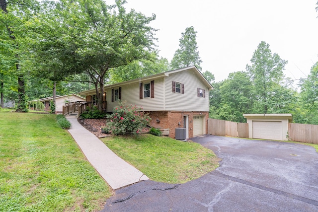 view of property exterior featuring a garage, a yard, and central AC