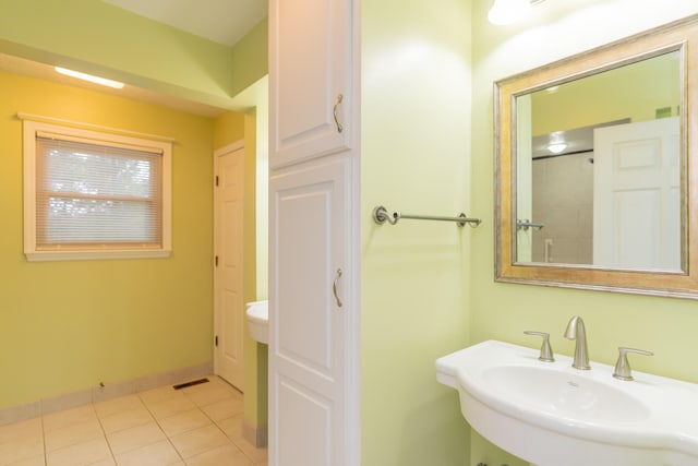 bathroom featuring sink and tile patterned flooring