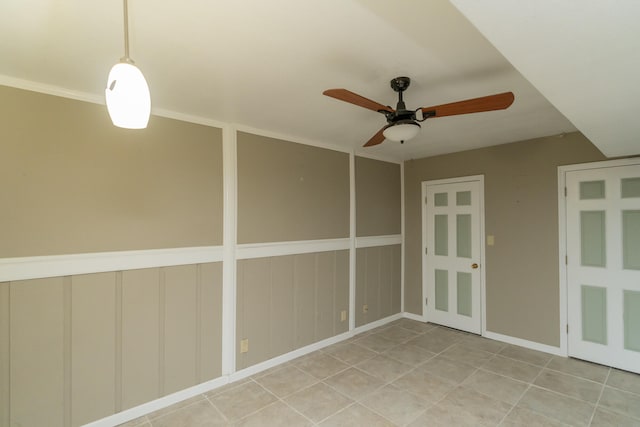 spare room with ceiling fan and ornamental molding