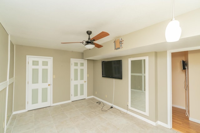 spare room featuring ceiling fan