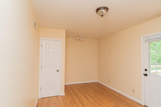 spare room featuring light wood-type flooring