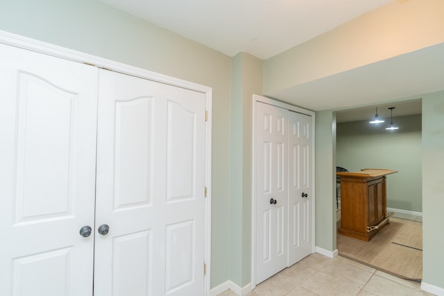 hallway with light tile patterned flooring