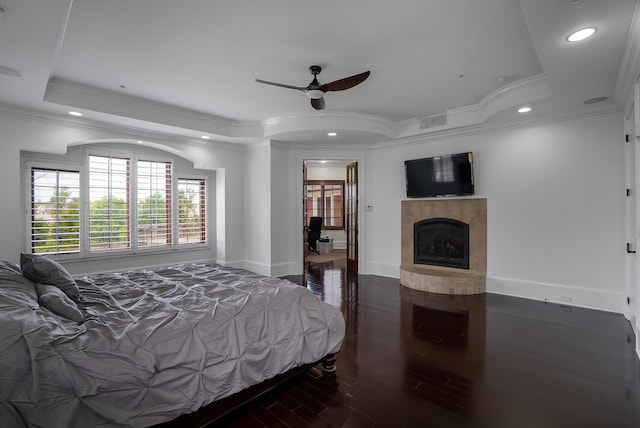 bedroom featuring ornamental molding, dark wood-type flooring, and ceiling fan