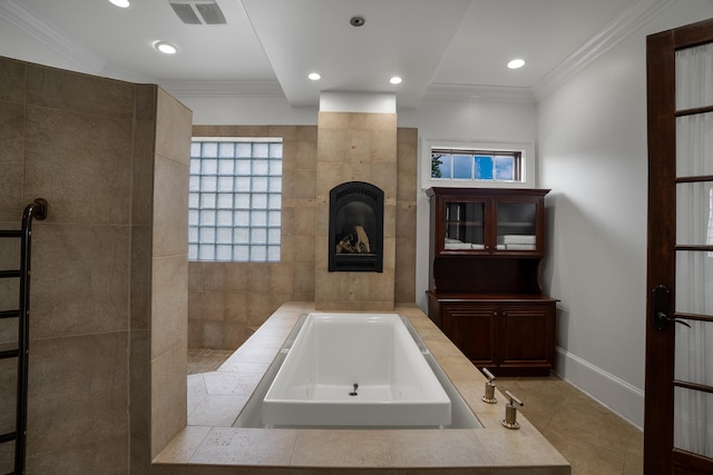 bathroom with crown molding and a washtub