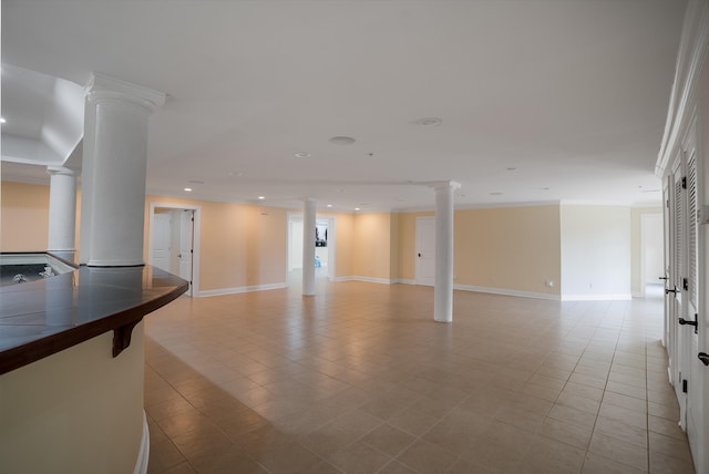 interior space featuring light tile patterned floors and decorative columns