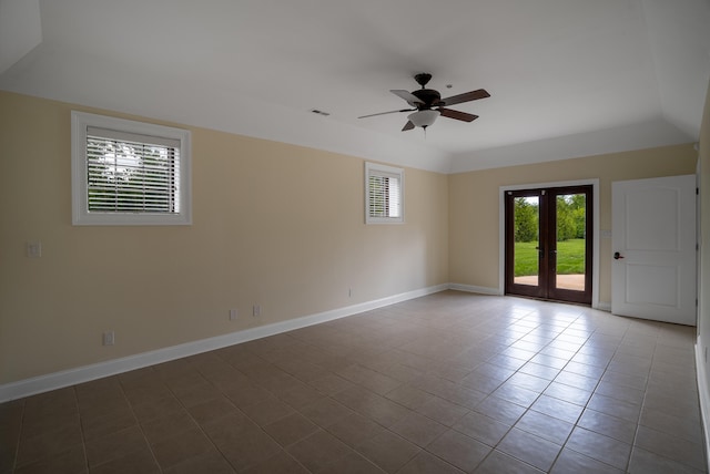 tiled spare room with ceiling fan and french doors