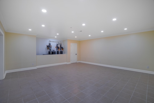 empty room with ornamental molding and tile patterned floors