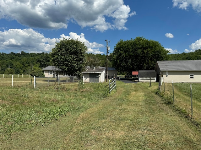 view of yard with a rural view