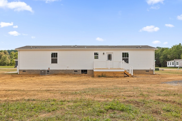 rear view of property featuring central air condition unit