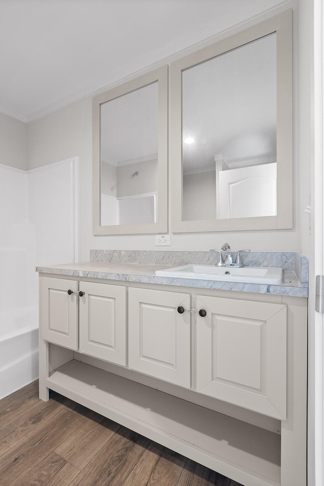 bathroom featuring hardwood / wood-style flooring and vanity