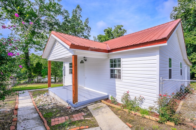 view of side of property featuring a porch