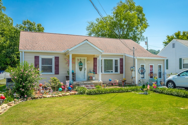 view of front facade with a front yard and a porch