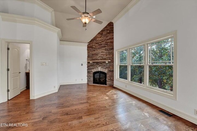 unfurnished living room featuring wood-type flooring, ceiling fan, high vaulted ceiling, and a fireplace