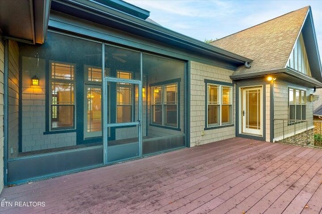 wooden terrace featuring a sunroom