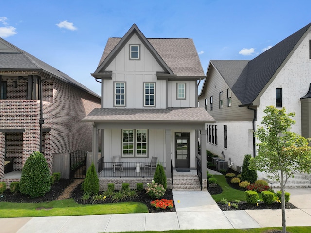 view of front of property with central AC unit and a porch