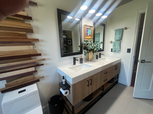 bathroom featuring vanity, toilet, and tile patterned floors