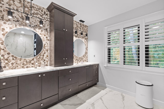 bathroom featuring vanity and tasteful backsplash