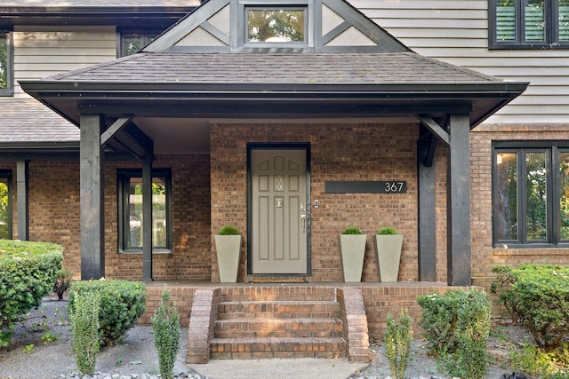 property entrance featuring a porch