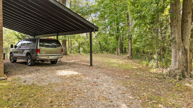 view of vehicle parking featuring a carport