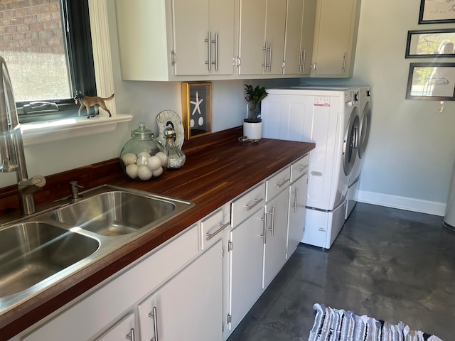 kitchen featuring wood counters and washing machine and dryer