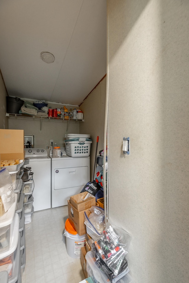 storage area featuring independent washer and dryer