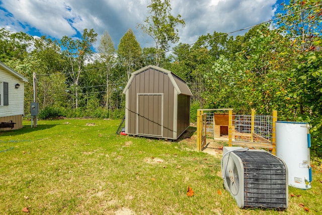 view of outdoor structure featuring ac unit and a lawn