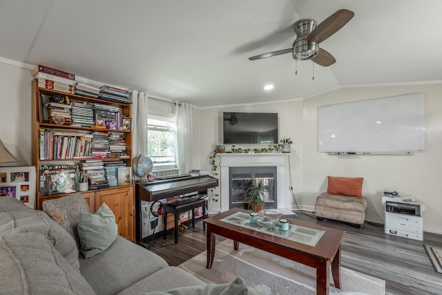 living room featuring crown molding, lofted ceiling, ceiling fan, and dark hardwood / wood-style floors