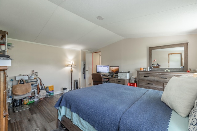 bedroom featuring dark wood-type flooring and vaulted ceiling