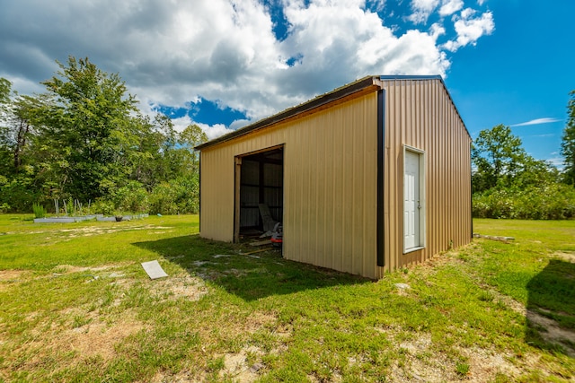 view of outbuilding with a lawn