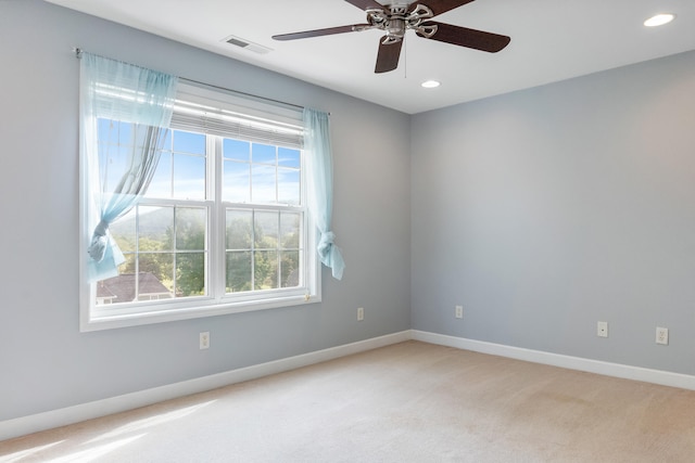 carpeted empty room featuring ceiling fan