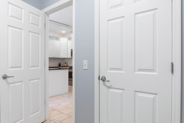 corridor with light tile patterned floors