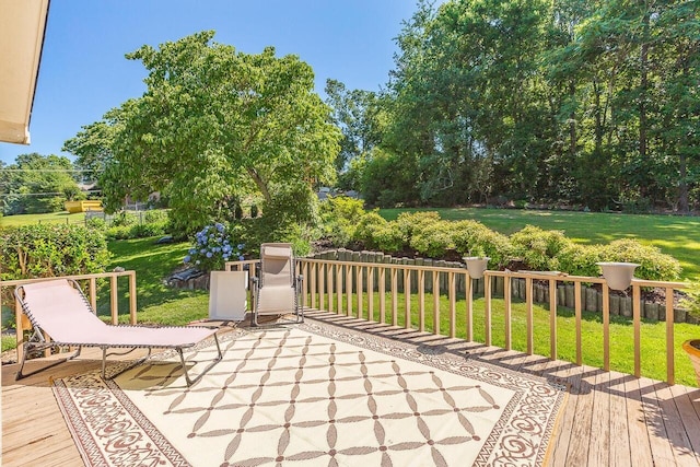 wooden deck with a lawn