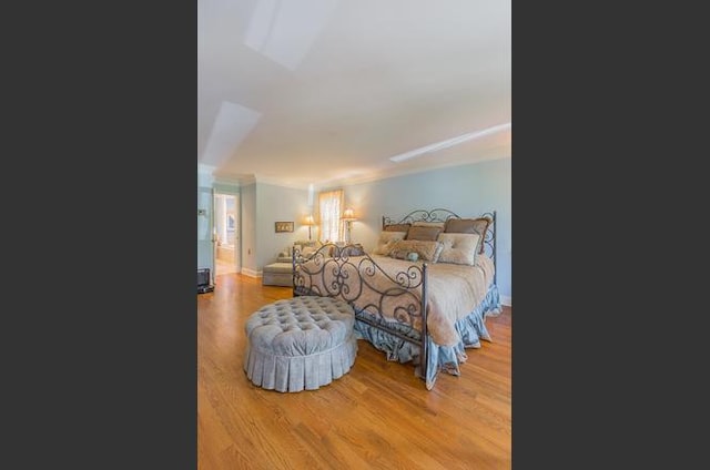 bedroom featuring hardwood / wood-style floors