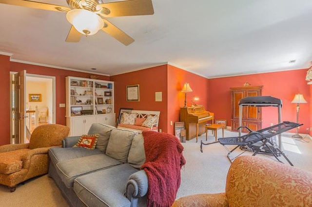 carpeted living room with ceiling fan and crown molding