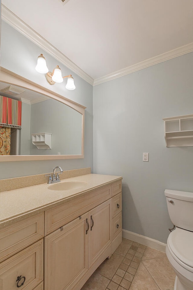 bathroom with tile patterned flooring, toilet, crown molding, and vanity